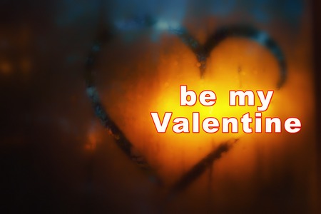 Valentine's day abstract background. The inscription on the sweaty glass is drawn a heart and written BE MY VALENTINE. Tintedの写真素材