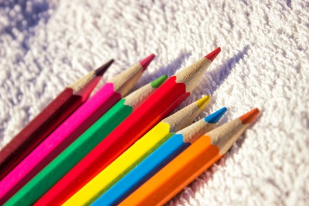Beautiful bright wooden pencils for drawing on a light background on a sunny day. Copy space.の写真素材