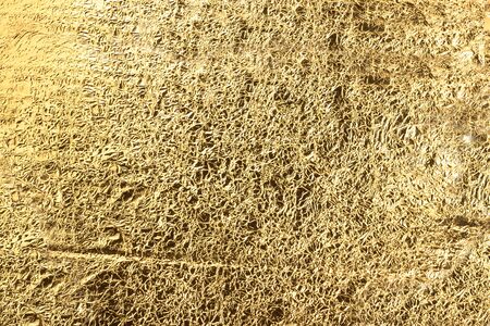 Abstract light Golden yellow background of crumpled aluminum foil. Can be used for design as a background.Golden textureの写真素材