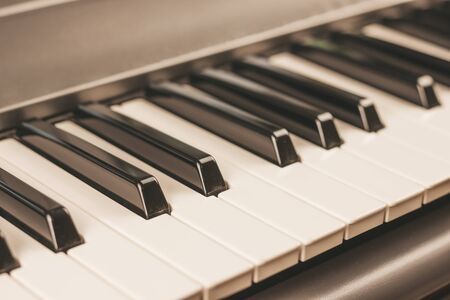 Close-up of white and black piano or synthesizer keys. Musical instrument. Hobbies music.の写真素材