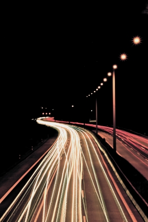street in the night with driving carsの写真素材