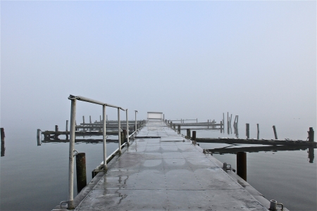 a bridge on a foggy autumn dayの写真素材