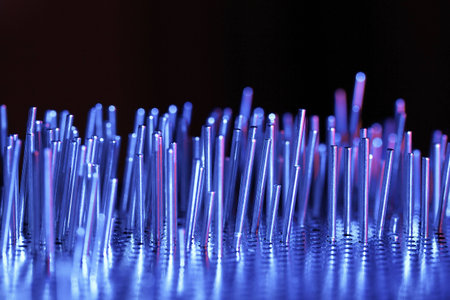 a group of metal rods meets colored lightの写真素材
