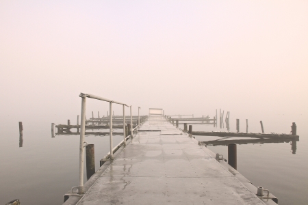 a lake on a foggy october morningの写真素材