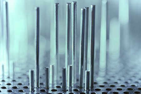 a group of metal rods meets colored lightの写真素材