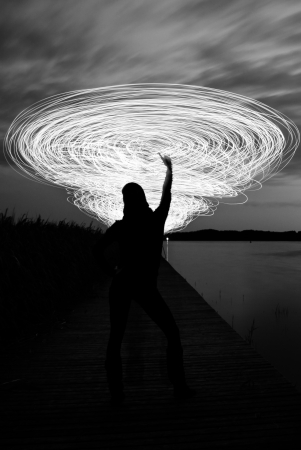 a women in the night who play a light game