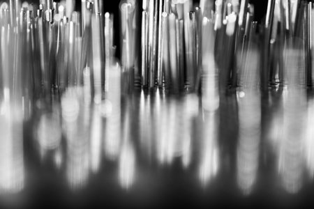 a group of metal rods meets colored lightの写真素材