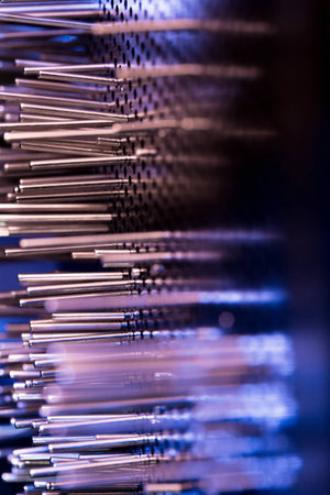 a group of metal rods meets colored lightの写真素材