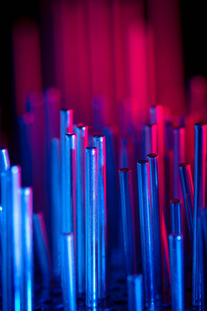 a group of metal rods meets colored lightの写真素材