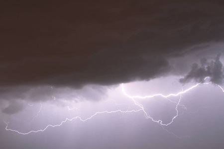 the dark sky and a flashの写真素材