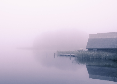 a foggy water landscape on a november morningの写真素材