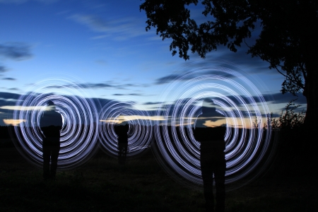 a men make a light show in the nightの写真素材