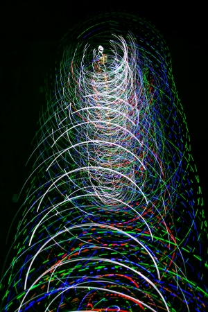 a men make a light show in the nightの写真素材