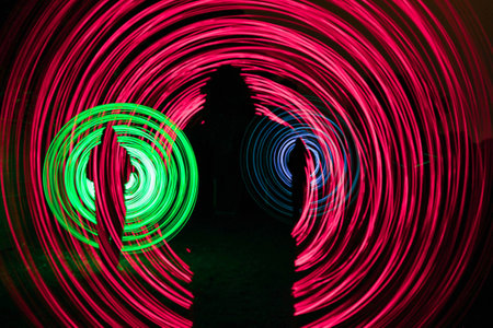 people make a light show in the nightの写真素材