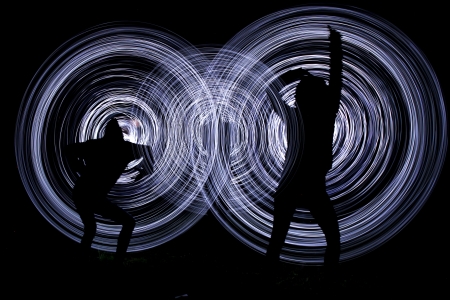 people make a light show in the nightの写真素材