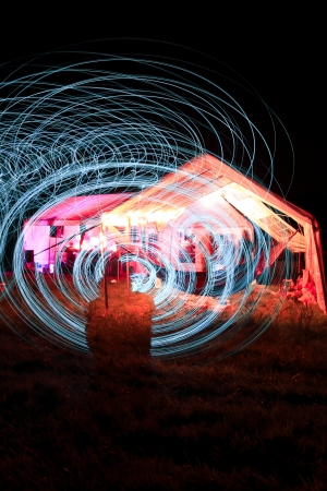 a men make a light show in the night