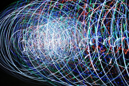 people make a light show in the nightの写真素材