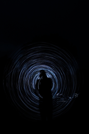 people make a light show in the nightの写真素材