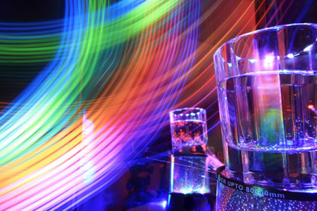 A glass in the colorful nightの写真素材