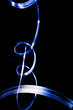 people make a light show in the nightの写真素材
