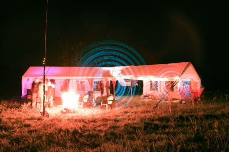 people make a light show in the nightの写真素材