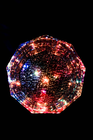 A glass in the colorful nightの写真素材