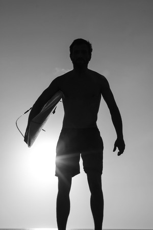 A shadow of a man in the sunsetの写真素材
