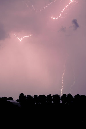 the dark sky and a flashの写真素材