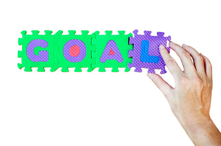 Women hold L alphabet add to GOAL wordの写真素材