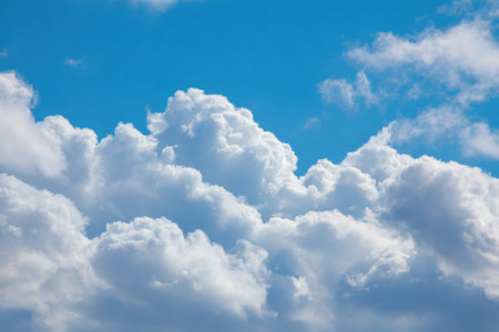 Serene cloud formations in bright blue skies perfect for wellness projects, travel brochures, and nature-inspired backgrounds to evoke tranquility and peaceの素材