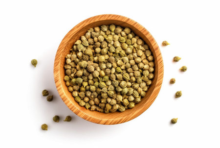 flat lay top view of dried coriander seeds in the wooden bowl isolated on white background. generatif aiの素材