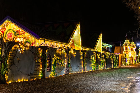 Magic Parc Rasnov Decorated Wall Illuminated with Christmas String Lights at Nightのeditorial素材