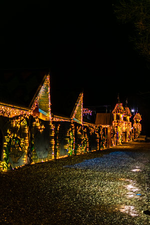 Magic Parc Rasnov Decorated Wall Illuminated with Christmas String Lights at Nightのeditorial素材