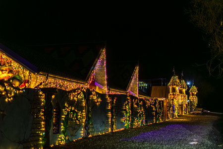 Magic Parc Rasnov Decorated Wall Illuminated with Christmas String Lights at Nightのeditorial素材
