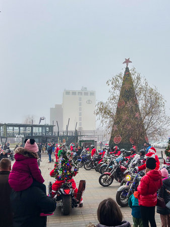 BRASOV, ROMANIA - DECEMBER 21, 2025: Santa Claus bikers gathering for a Christmas charity event at Coresi Shopping Resort in Brasov.のeditorial素材
