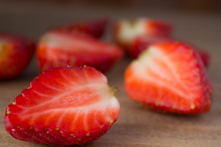red ripe  fresh strawberries on wooden tableの写真素材