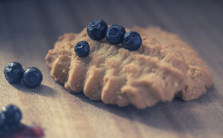 cookies with juicy blueberries, on wooden tableの写真素材