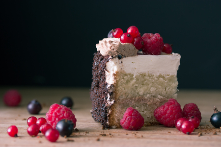peace of cake decorated with fresh berriesの写真素材