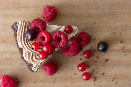 peace of cake decorated with fresh berriesの写真素材