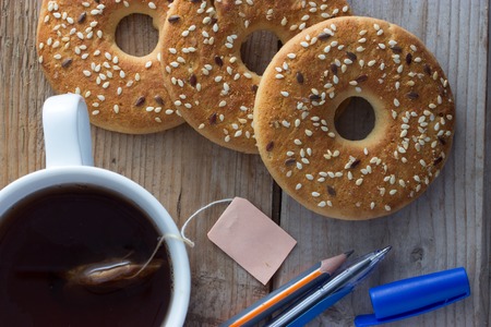 cookies and white mug of tea, office conceptの写真素材