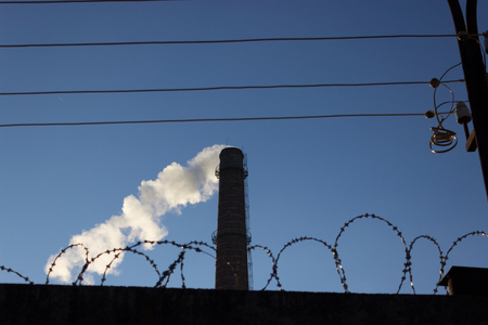 pipe smoke and a barbed wire. security plantの写真素材