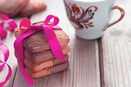 Valentine's Day, romantic template cookie bow and cup of teaの写真素材