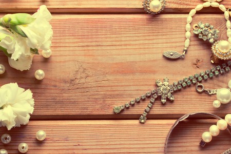 antique vintage silver jewellery on wooden tableの写真素材