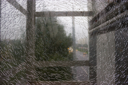 Shattered window. unfocused view thought the brocken window