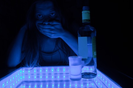 alcohol intoxication concept. woman in a bar feel sick because of alcohol