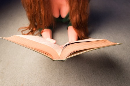 sexy girl in green clothes read a book
