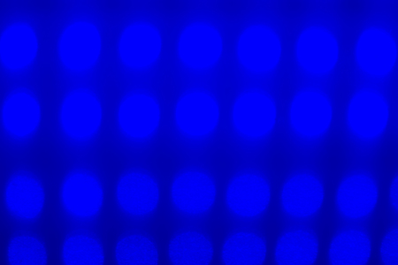 Multicolored defocused bokeh lights background. illuminated table