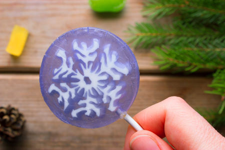 christmas sweets on wooden background. pine tree branchesの写真素材
