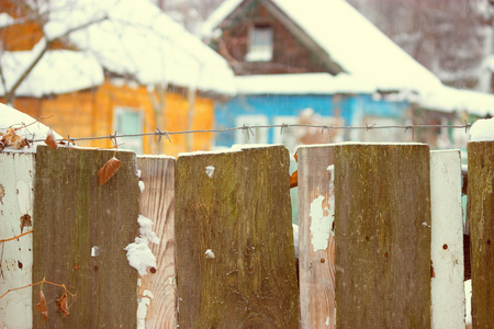 Snow house in winter dreamland at dawn in forest old weather and a lot of snow on roofの写真素材