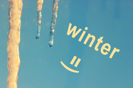 icecle on a background of blue sky. winter conceptの写真素材